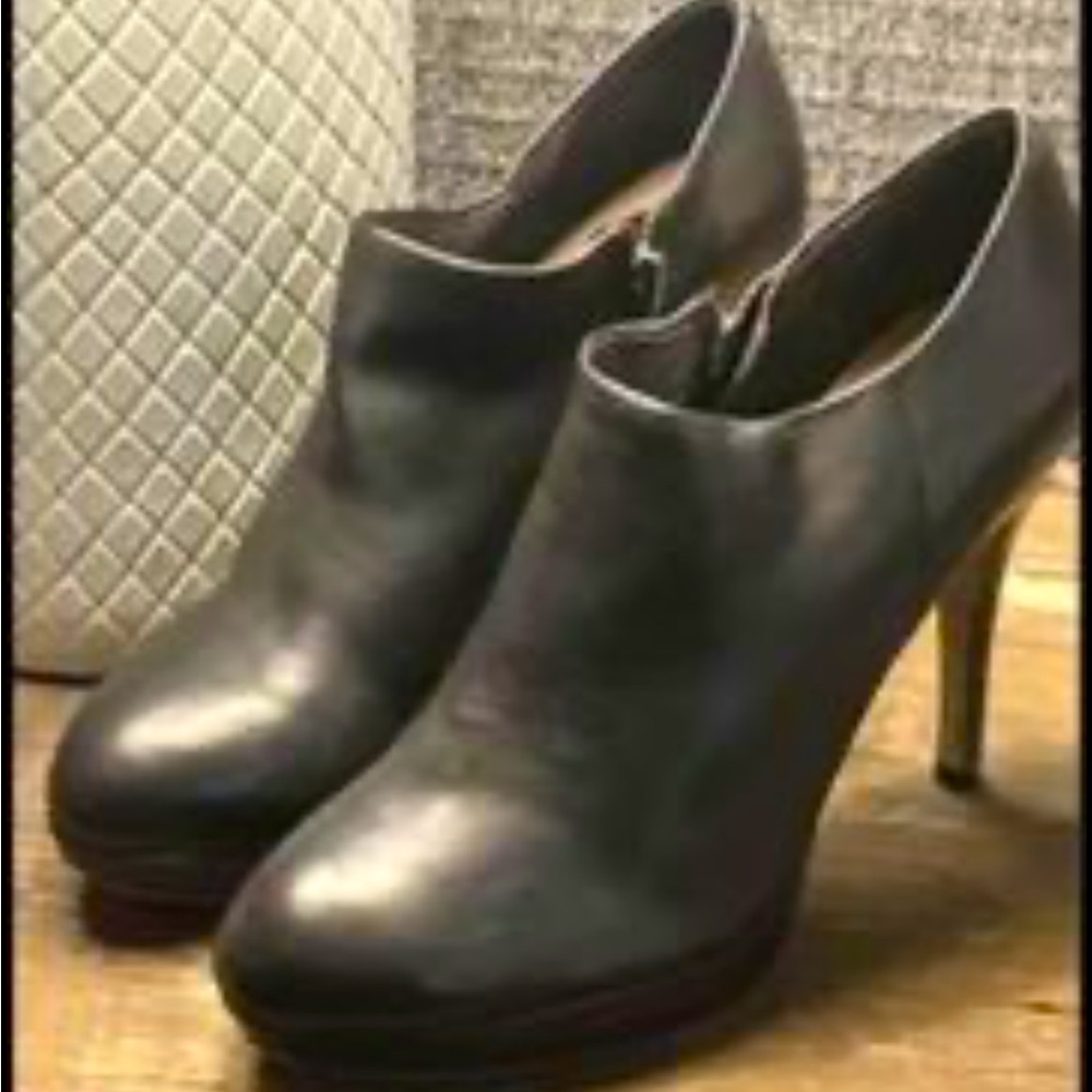 Black Vince Camuto  size 7 with slight platform pad and side zip. barely worn.